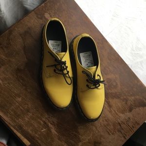 Bright yellow doc martens